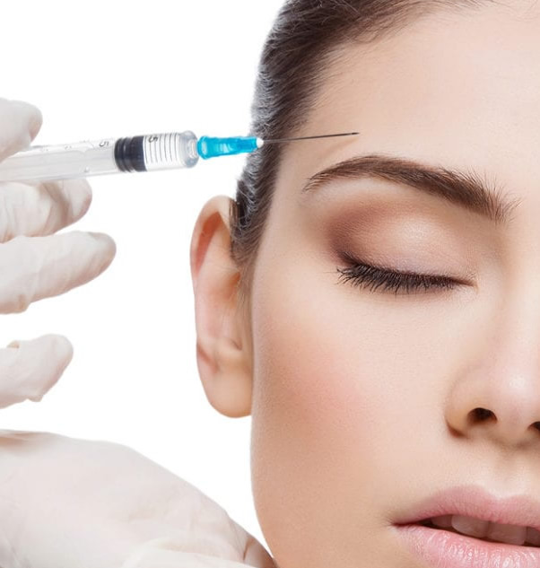 BOTOX therapy treatments - photo of doctor injecting forehead