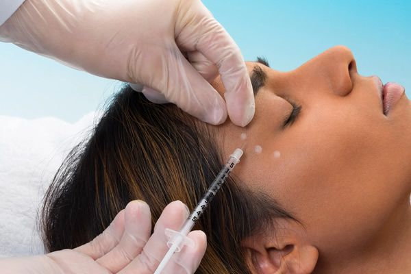 woman receiving BOTOX treatment